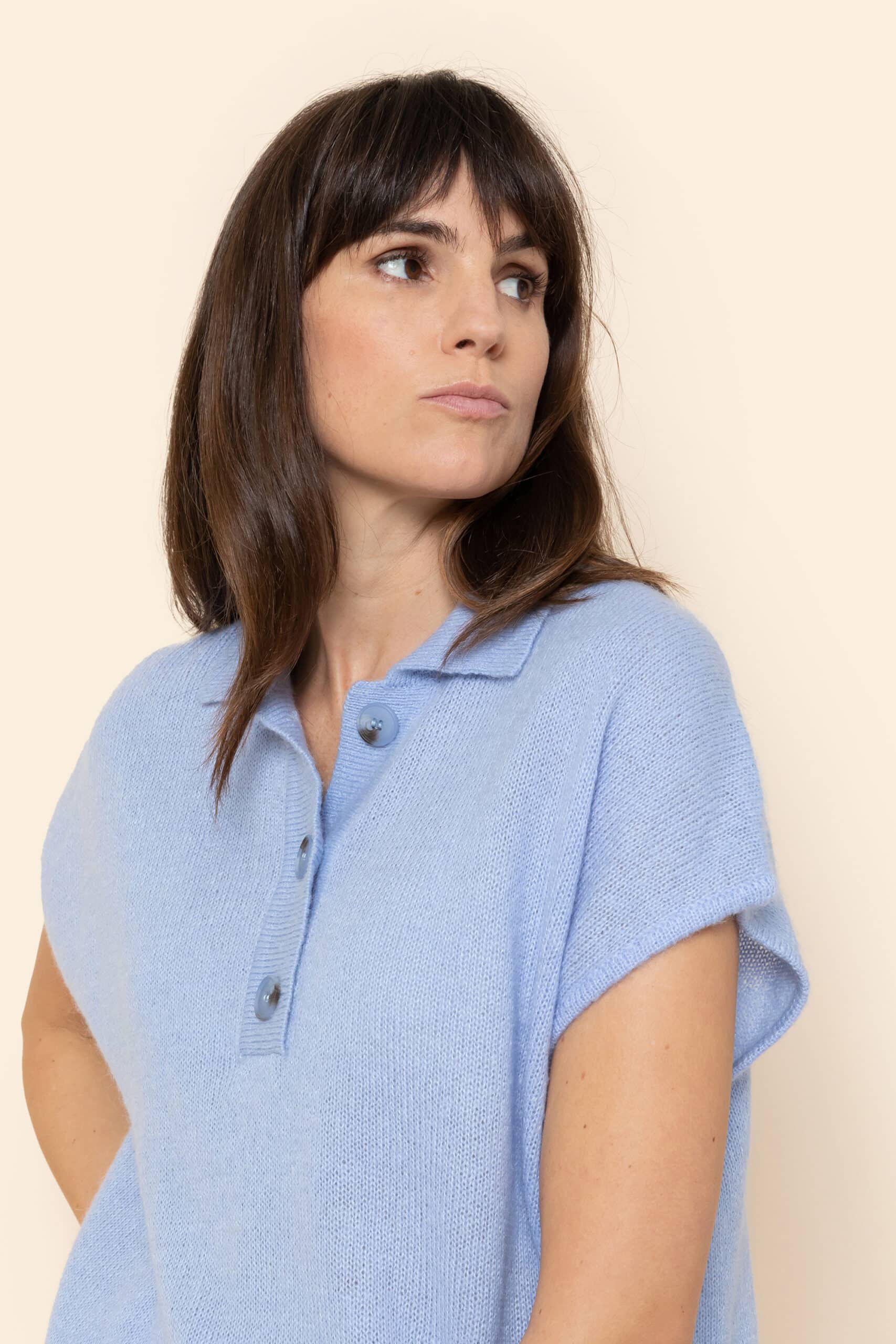 Lavender sleeveless pull-on sweater with ribbed collar and row of buttons - Image 2