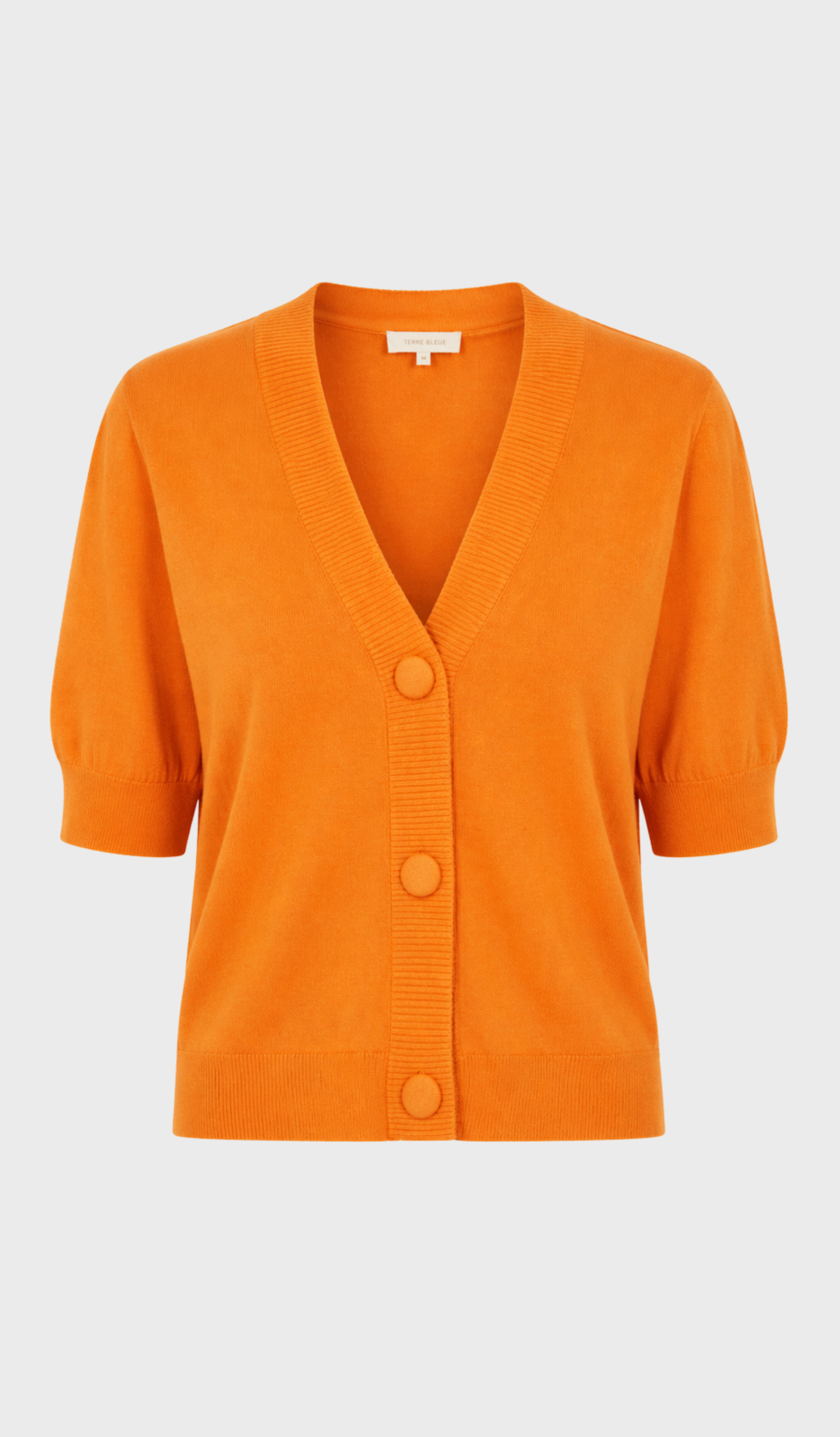 light orange cardigan